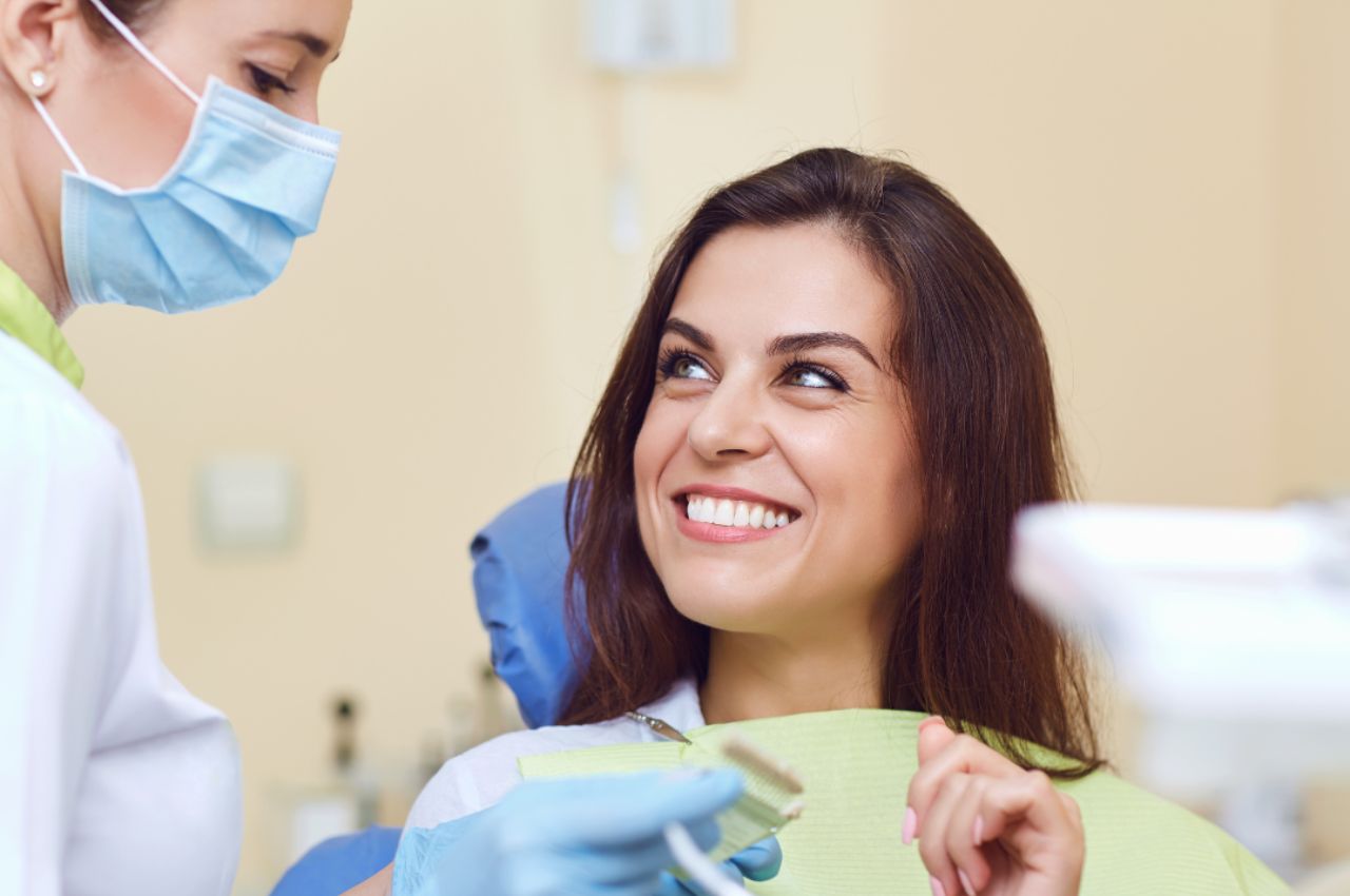 woman-at-dental-cleaning woman smiling at dental visit